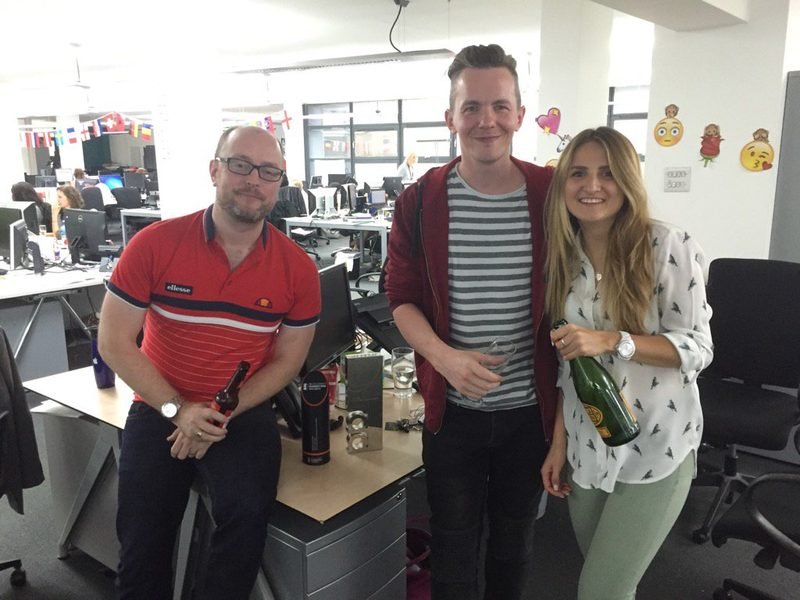 Chris and team celebrating a social media award